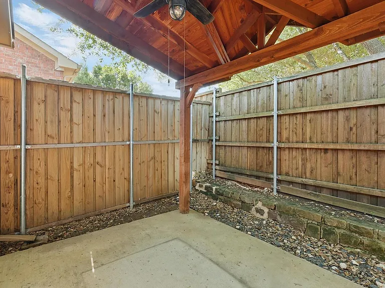 tep outside to a quaint covered patio with a ceiling fan_just right for a quiet coffee break or casual evening breeze.