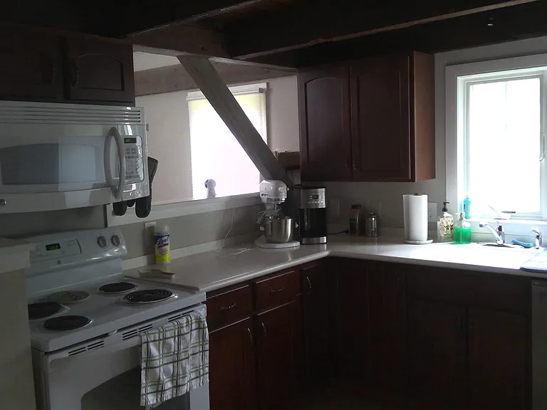 Custom Kraft-maid cherry cabinetry, Corian countertops