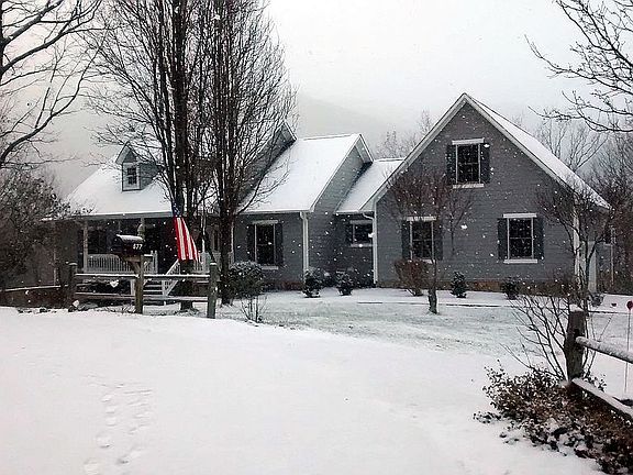 new gray color home in snow