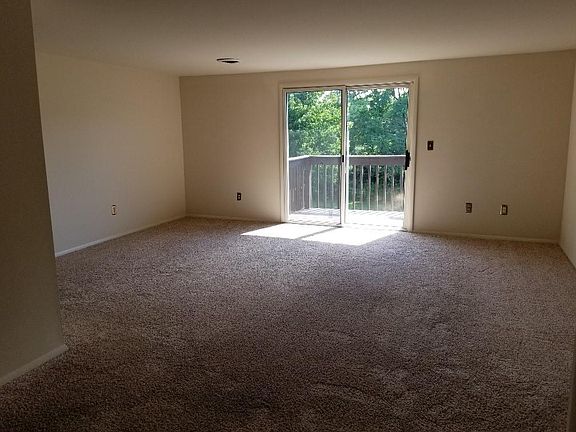 Living room with access onto deck