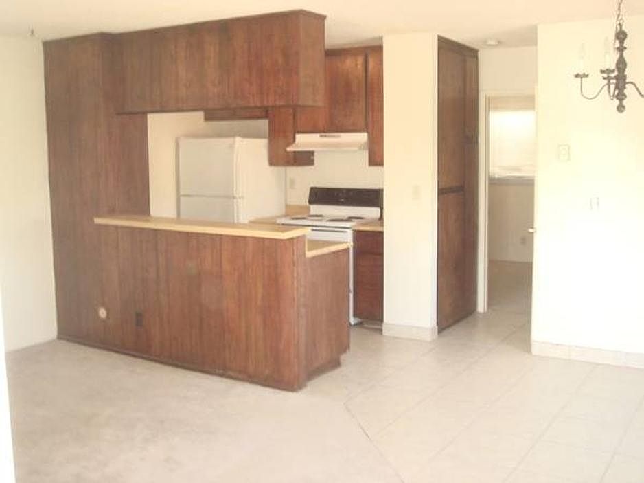 Living room with view of kitchen.
