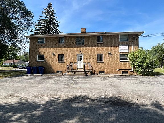 Back of Building with 1 parking spot.