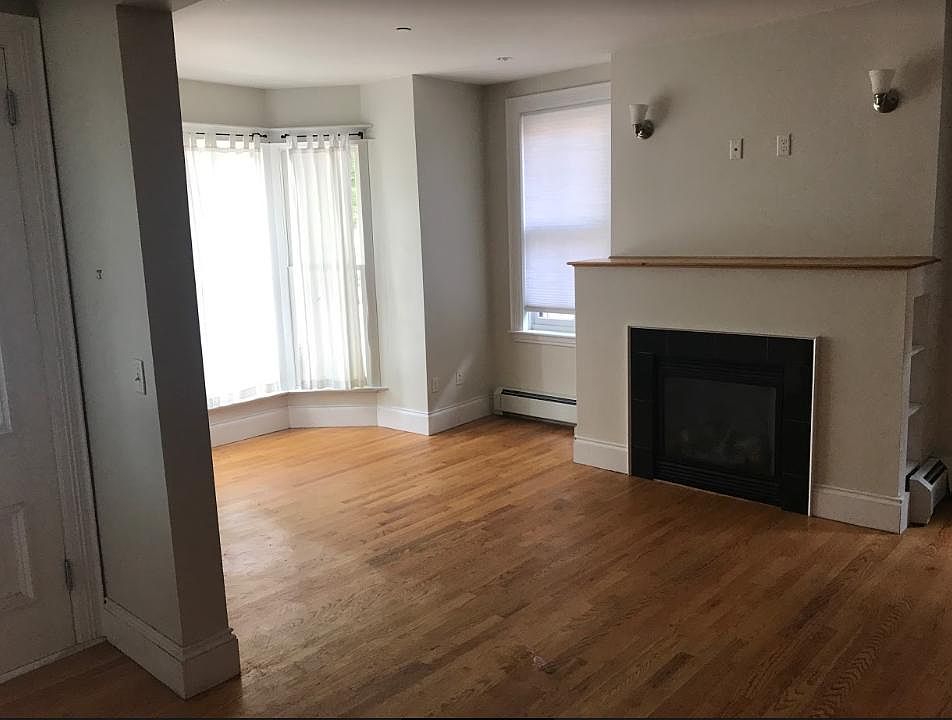 Living room flowing into the dining area.