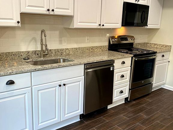 Kitchen - completely renovated with new appliances, granite, wood-grain ceramic tile