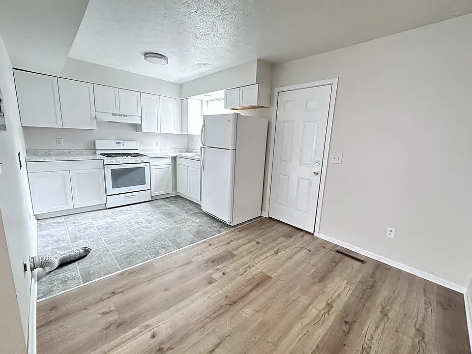 Kitchen with laundry and dining room area.