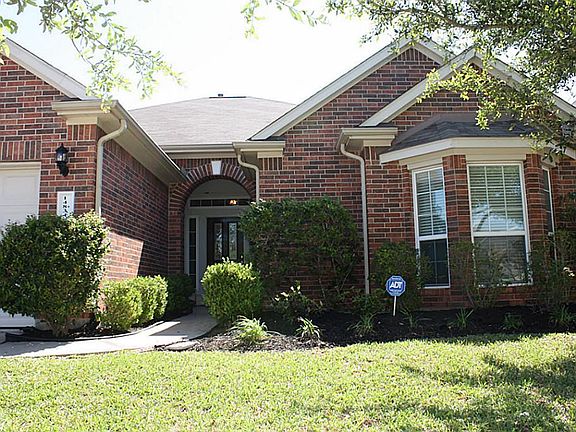 Traditional styling and well-kept landscaping.