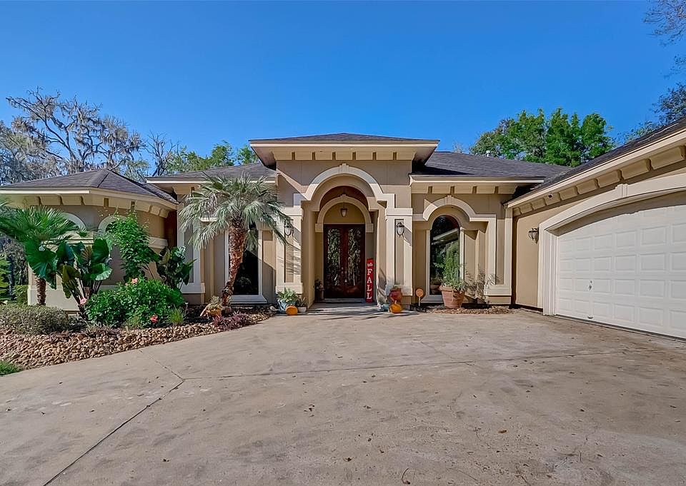 WOW! This is a rare find! Custom built Mediterranean home w/3-car garage, storage shed, greenhouse, and private driveway on 2.54 acres off 288 in Angleton.