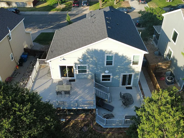 Aerial view of backyard; Big lush trees