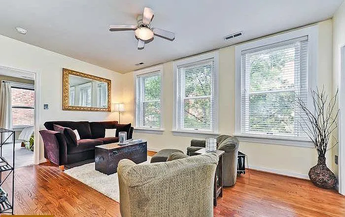Open living room with lots of windows for plenty of natural light