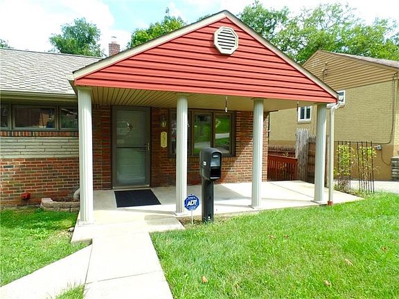 Beautiful level entry offers custom, covered front porch, with side deck that leads to the kitchen...