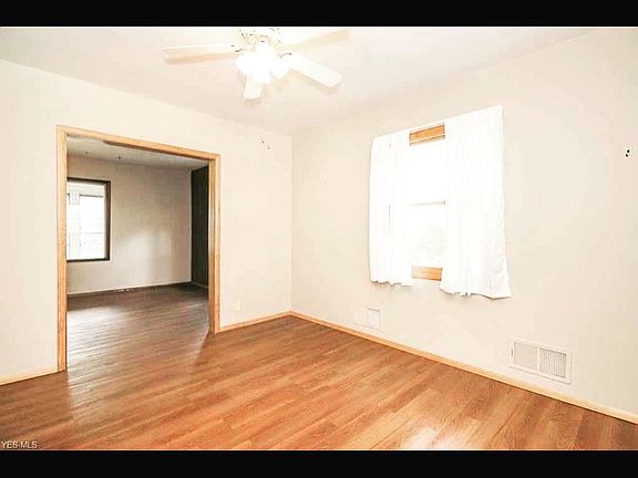 Dining room opens to a specious living room.