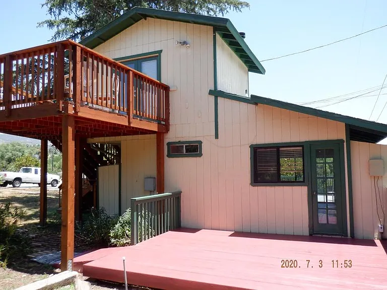 rear of house with rear upper and lower decks