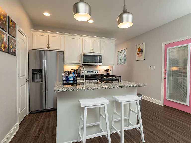 Fully stocked kitchen with all major appliances and island seating for two_ideal for cooking, dining, or sharing a morning coffee.