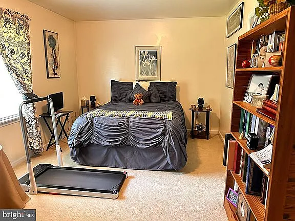 Bedroom #2 on the upper floor with window opening to the back yard (the East side).