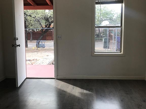 Large living room with plenty of windows.