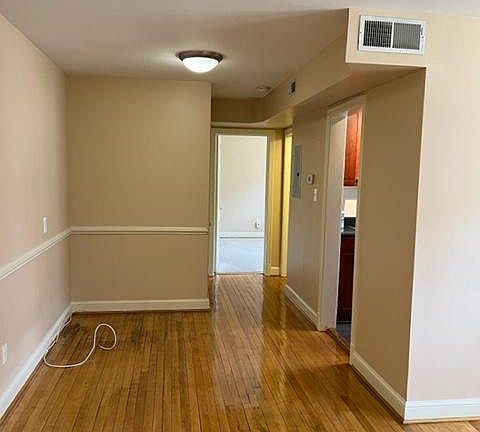 Living room, view towards kitchen and bedroom.