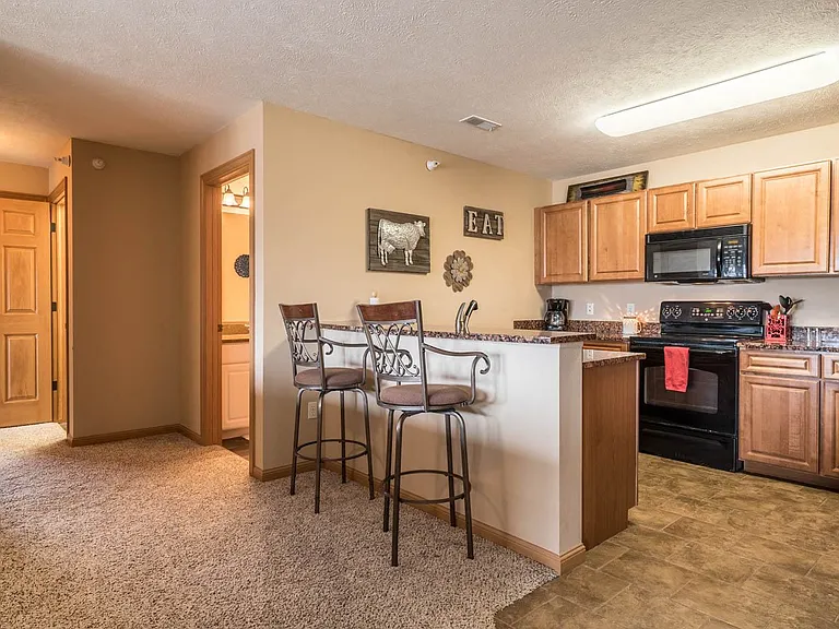 Enjoy an open-concept kitchen and dining area, perfect for casual meals or entertaining guests.