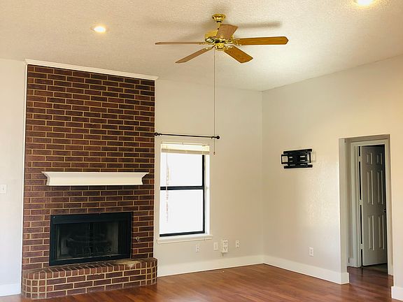 Gorgeous living room with fireplace. Open, with lots of natural light and vaulted ceilings. Beautiful cherry floors.