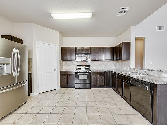 Generously-sized Kitchen. Refrigerator Conveys.