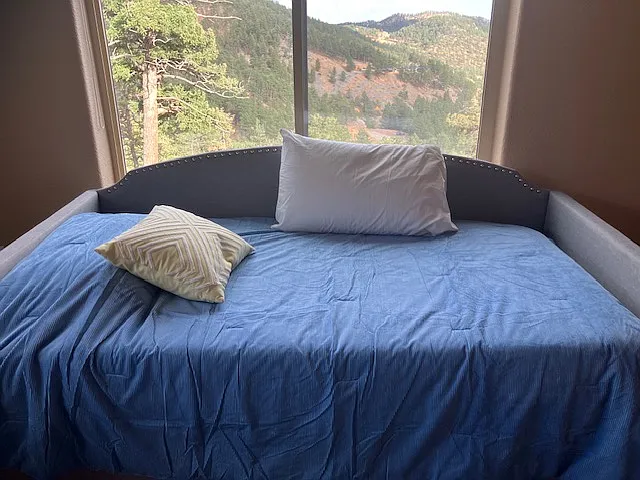 Daybed and view. However, when I get a smaller desk, the daybed will go on the back wall and you'll be able to take in the view.