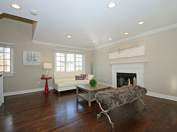 Living room adjacent to entry stairs