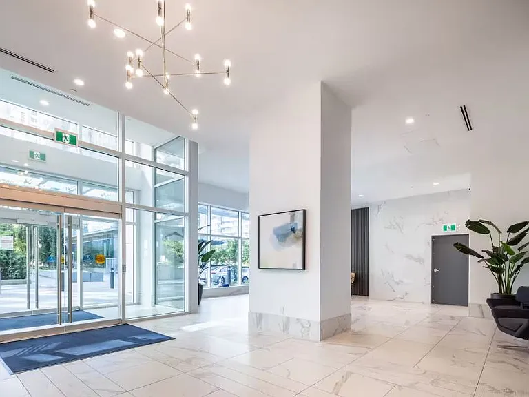 The view from the entrance is greeted by a minimalist design that fosters a calm and open atmosphere.