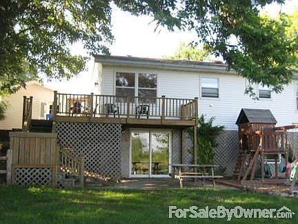Deck, Walk-out basement : Basement walks out to a patio and fenced in yard with an extra storage she