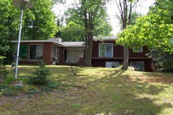 Price Reduced at Lake Hiawatha... Waterfront home with sunporch, walkout basement & garage. Over 1444 sq ft, natural gas heat, fireplace with insert, several doorwalls on lake side for great views from living, dining & master bedroom. Attached 26x28 garage.