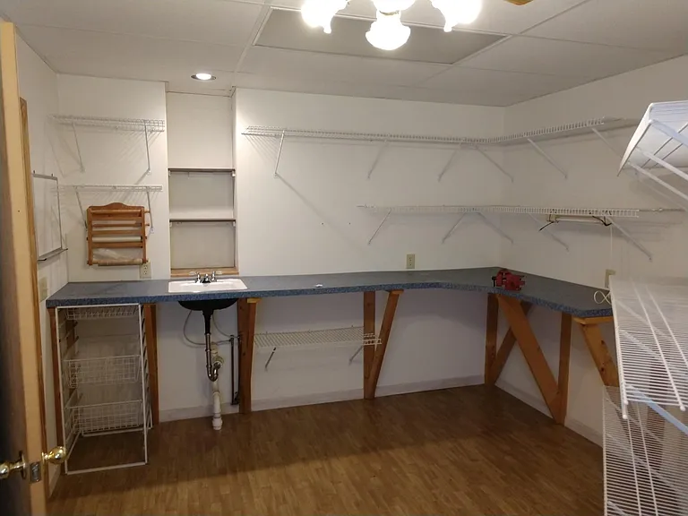 Small bedroom. Shelves and counter is removed. Faucet/sink are still available.