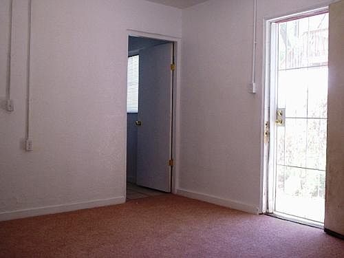 Bedroom with door to patio