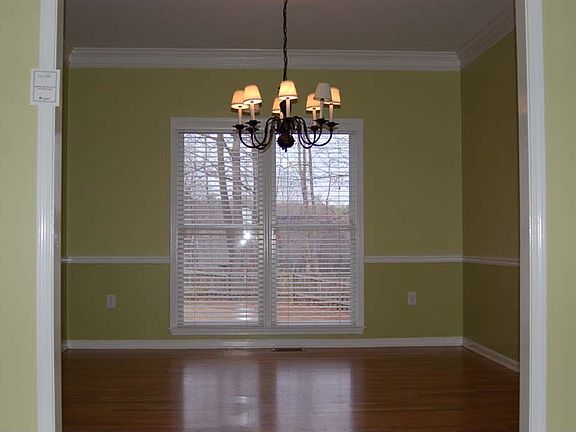 Casually elegant dining rm flows from frml living rm w gleaming hardwoods!
