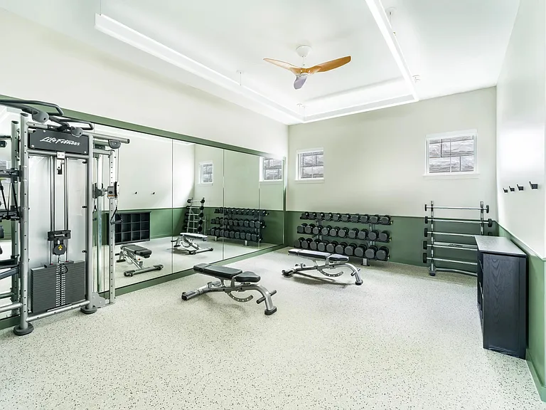 Stretch, lift, and focus on your form in this strength-training space outfitted with benches, free weights, and floor-to-ceiling mirrors.