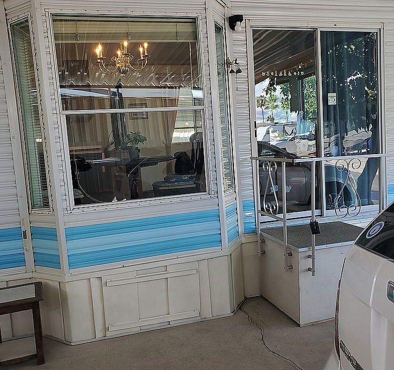 Trailer, car in driveway