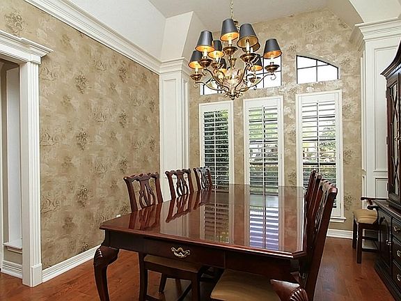 Dining room  with wood floors.