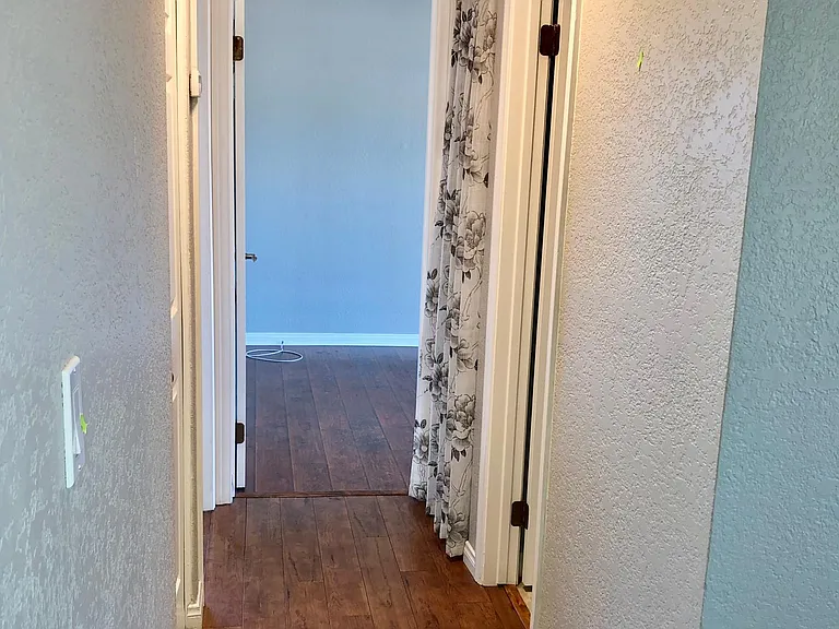 Main hallway to the bedrooms. There are extra shelves for more storage.
