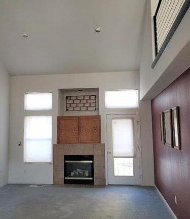 Great room has vaulted ceiling, ceiling fan and ga