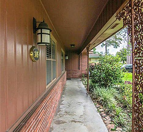Ahh...the front porch! There is just something about a front porch that makes a home feel cozier. This front porch offers lighting and a great view of the quiet street.