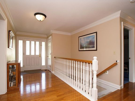Mahogany and leaded glass front door leading into foyer