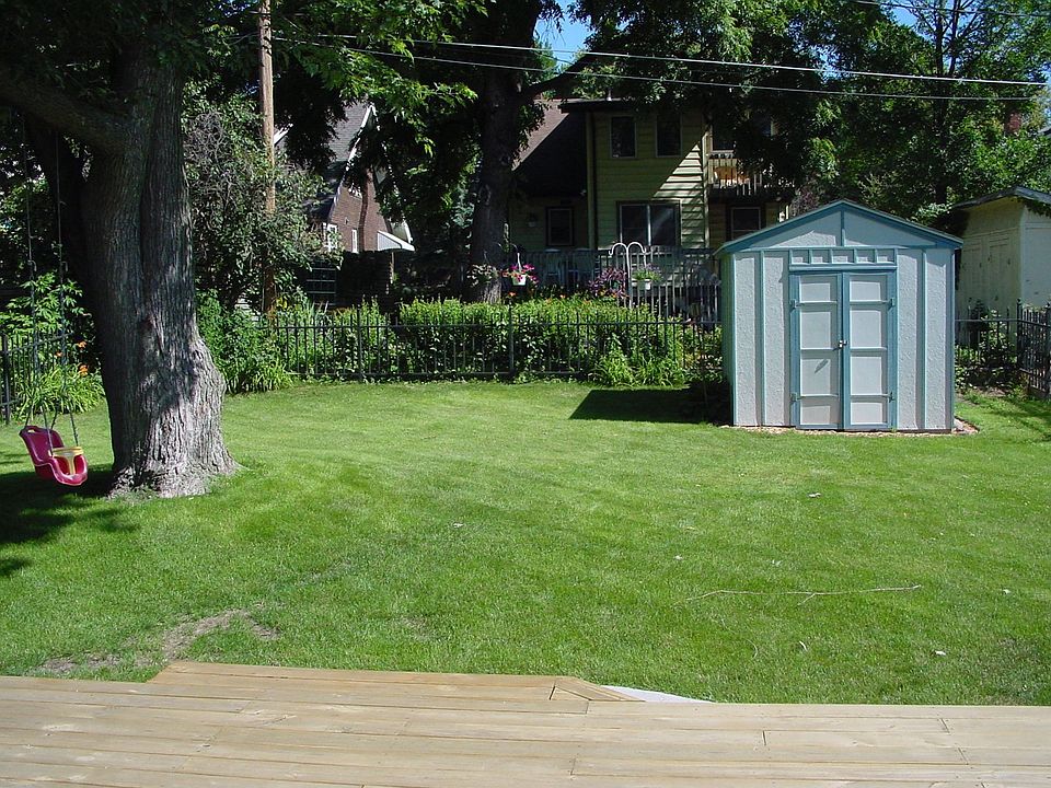Shed, wrought iron fence.