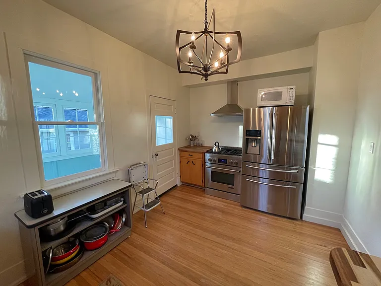Back door to enclosed back porch that leads to unfinished basement, laundry area and huge back yard.