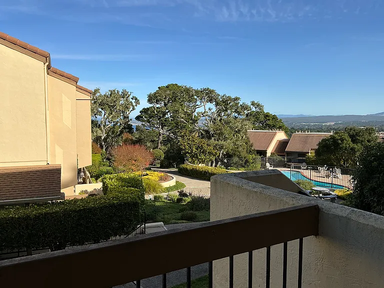 View from large balcony (swimming pool and cabana below). BBQ grills available near cabana/swimming pool.