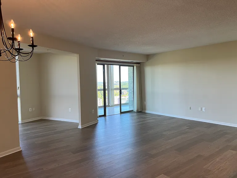 Living area and sliding glass door to large balcony