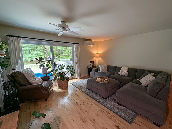 Living room with sliding glass door to back deck