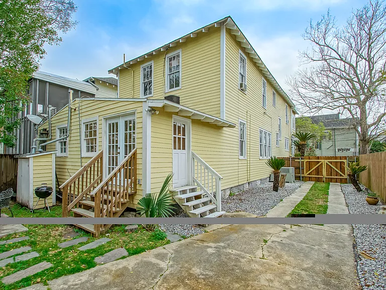 Rear view of home and driveway.