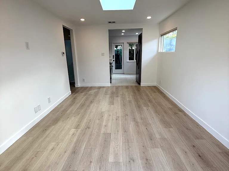 Living room with all new light floors.