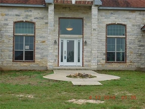 Front entry with circular drive to gate