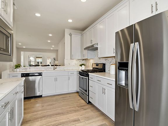 Model Representation - Calacatta Laza Quartz in the Spacious Kitchen