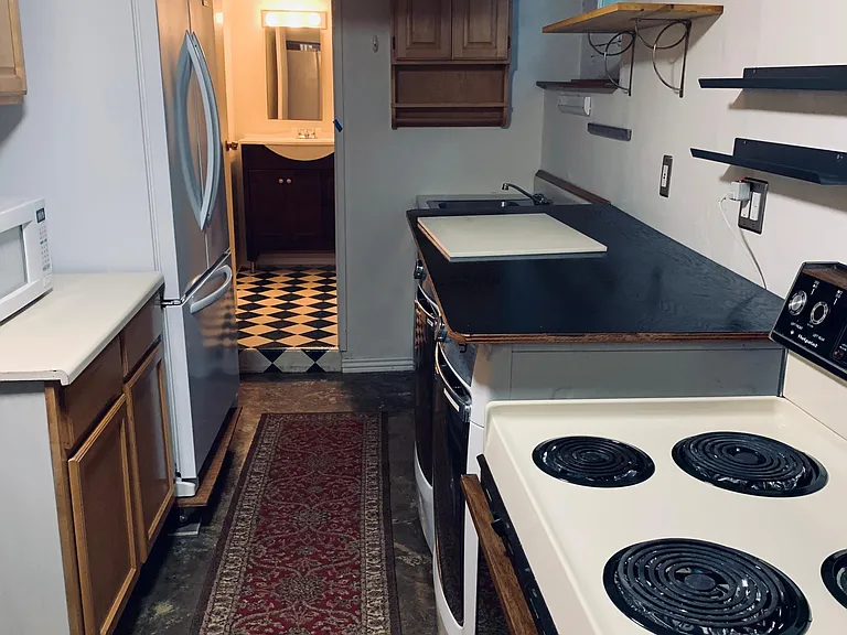 GALLEY KITCHEN WITH FULL SIZED SIDE-BY-SIDE REFRIGERATOR FREEZER