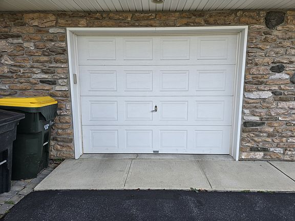 One car detached garage with extra space for storage.