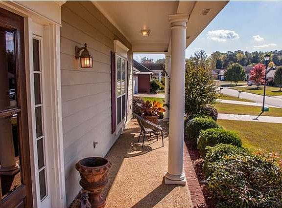Charming front porch and entry greets your guests